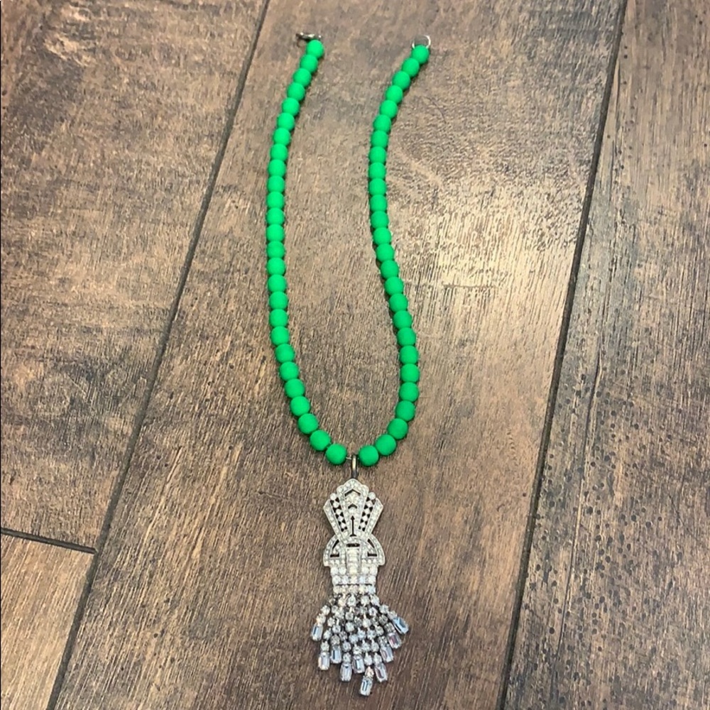 Green beaded necklace with crystal pendant